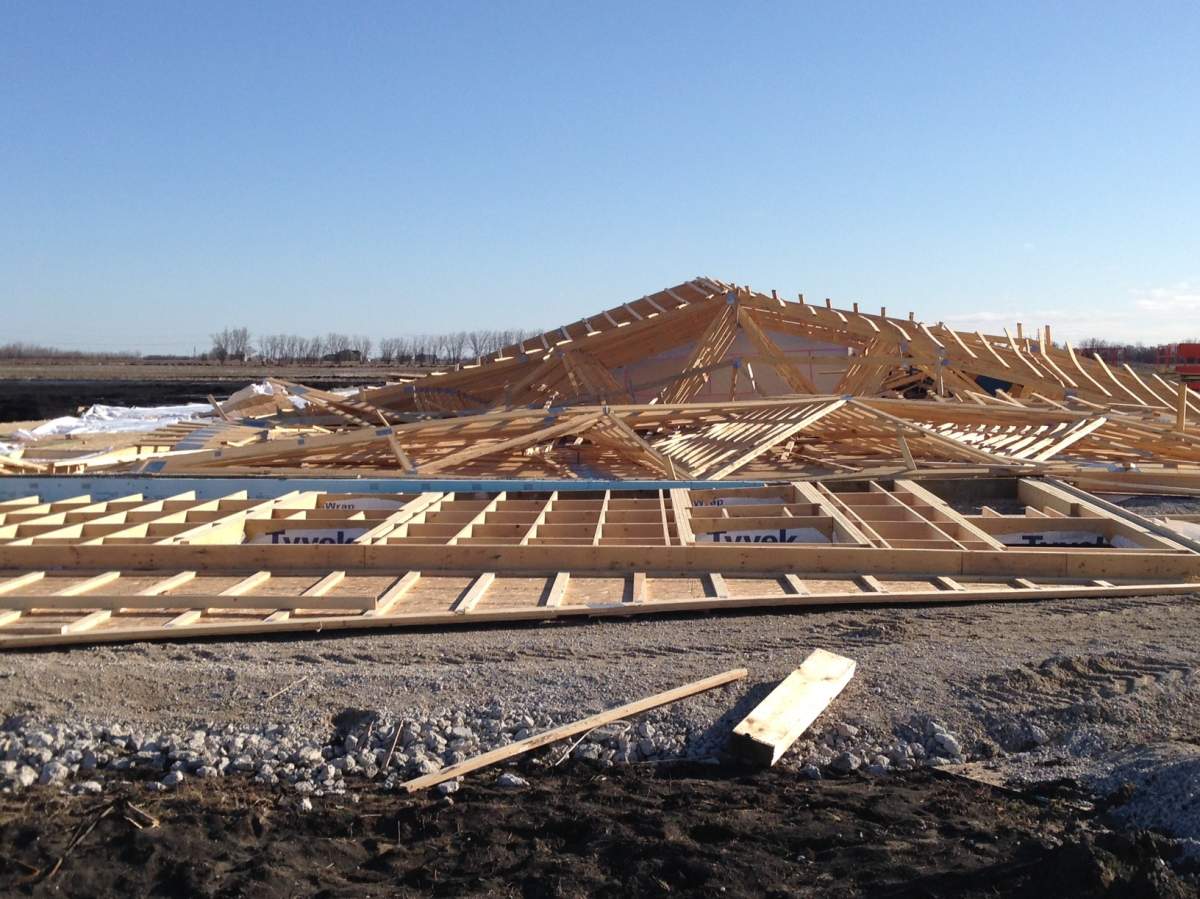 A building under construction just north of Winnipeg collapsed sometime over night .