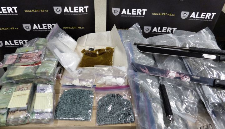 Three people have been arrested after more than 1,200 fentanyl pills were seized from an Edmonton home earlier this month.