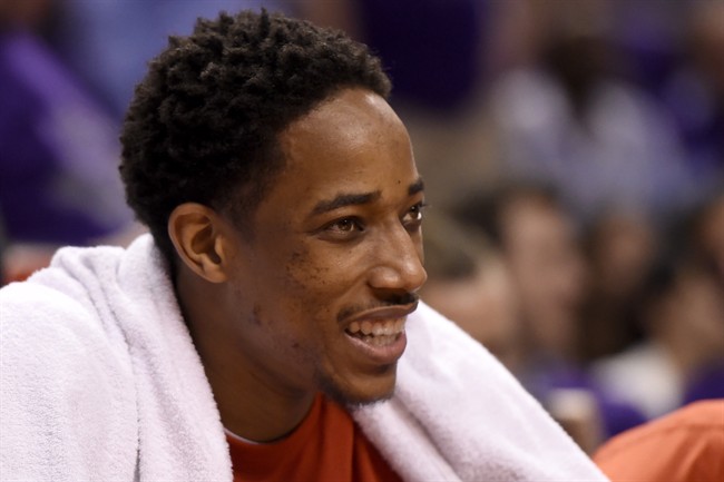 Toronto Raptors' DeMar DeRozan (10) smiles from the bench at the Air Canada Centre, in Toronto on Monday, April 18, 2016. 