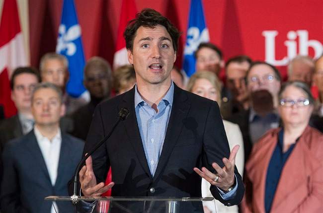 Prime Minister Justin Trudeau speaks to reporters during the 2016 Biennial Convention of the Quebec wing of the Liberal Party of Canada in Montreal, Saturday, April 30, 2016. 
