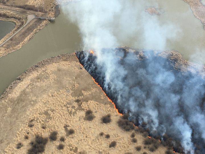 St. Albert fire crews battle a grass fire in Sturgeon County Thursday, April 14, 2016.