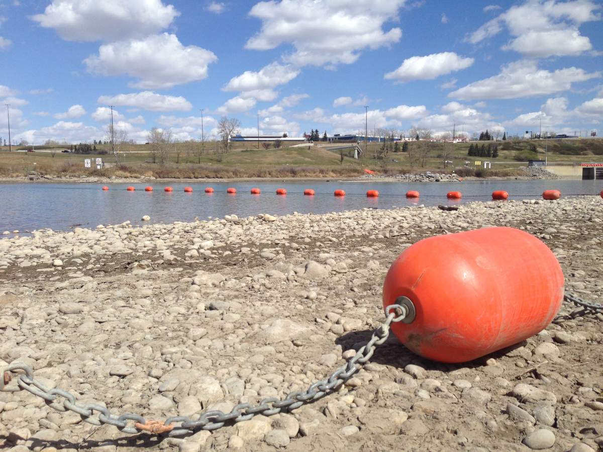 Safety booms installed Saturday at Harvie Passage on the Bow River in 2016.