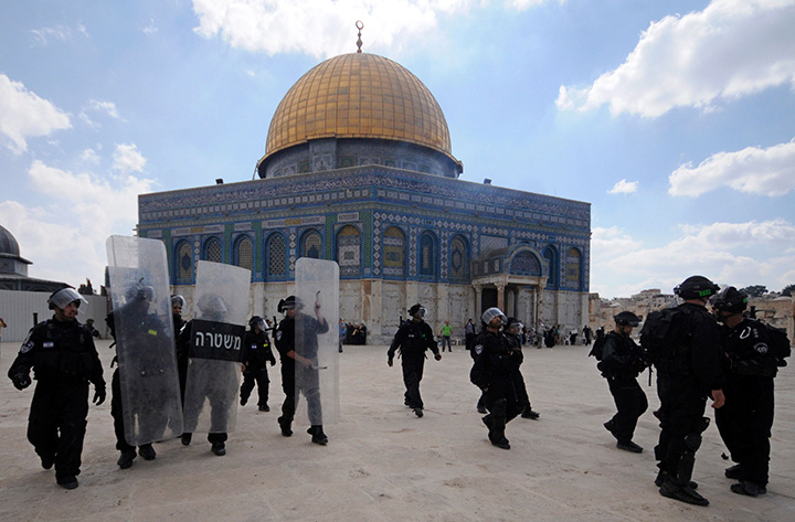 In this Oct. 5, 2012 file photo, Israeli forces take position during clashes with Palestinian worshippers at the Al-Aqsa Mosque compound in Jerusalem's Old City. Jordan's prime minister on Monday, April 18, 2016 said his government has decided to call off a plan to install surveillance cameras at Jerusalem's most sensitive holy site. 