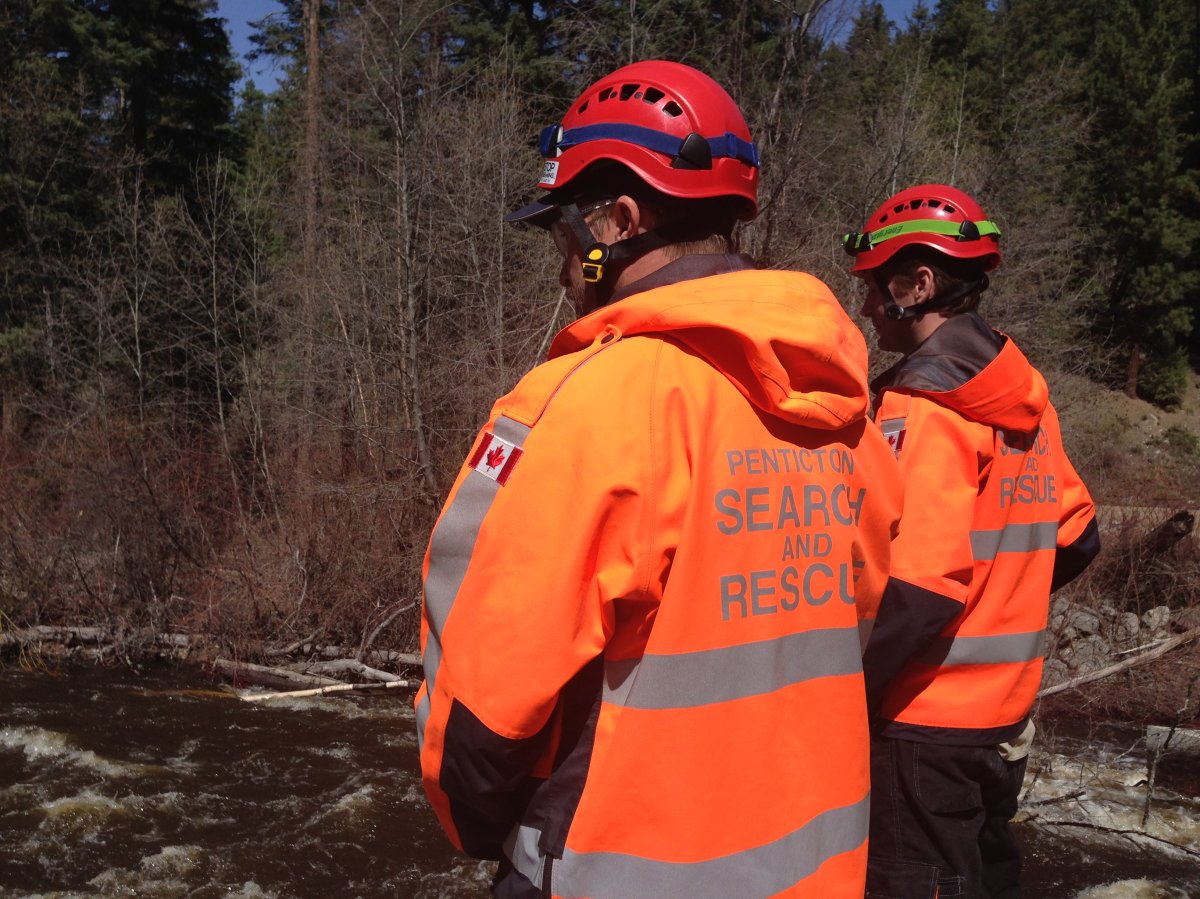 PENSAR members search Trout Creek for a man who was swept away by the fast-moving water after an ATV accident on Saturday. 