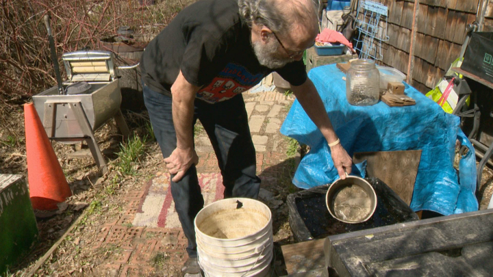 Instead of relying on the city water supply, Jim Elliot uses jugs from the store and rain runoff.