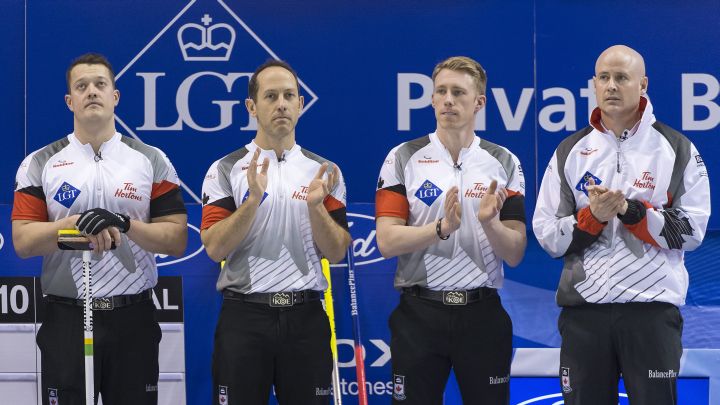 Canada's lead Ben Hebert, second Brent Laing, third Marc Kennedy and skip Kevin Koe, from left, applaud prior to the gold medal game between Canada and Denmark at the world men's curling championship 2016 in the St. Jakobshalle in Basel, Switzerland, on Sunday, April 10, 2016. 