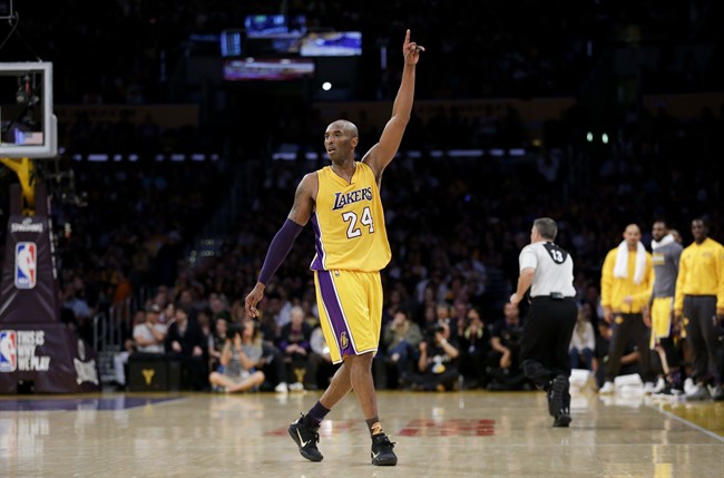 Los Angeles Lakers forward Kobe Bryant gestures during the first half of Bryant's last NBA basketball game, against the Utah Jazz, on Wednesday, April 13, 2016, in Los Angeles.
