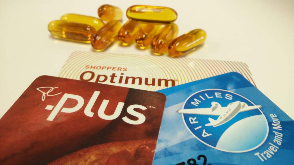 Air Miles, Shoppers Optimum and PC Plus loyalty reward program cards displayed with some pills.