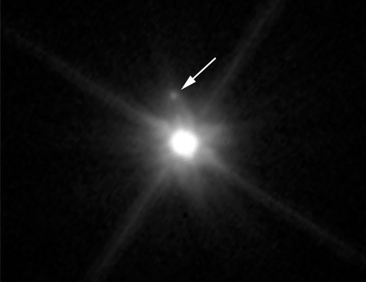 This Hubble image reveals the first moon ever discovered around the dwarf planet Makemake.