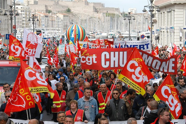 Employees, workers and students demonstrate in the Old-Port, in Marseille on Thursday, April 28, 2016 during a nationwide protest to reject a government reform relaxing the 35-hour working week and other labour rules.