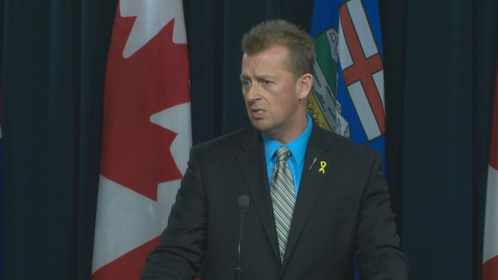 Calgary-West MLA Mike Ellis speaks to reporters after introducing Bill 205 in the  Alberta Legislature on April 20, 2016.