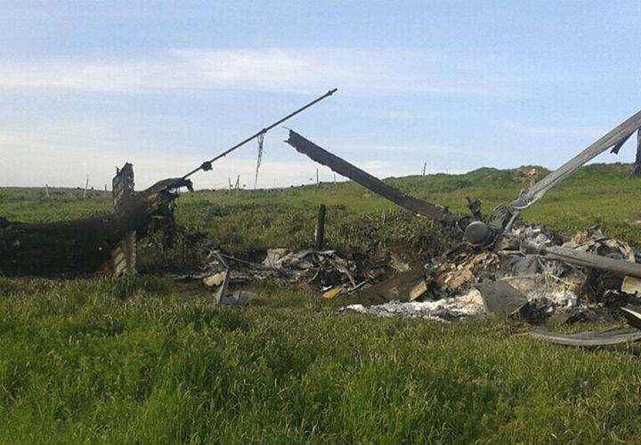 Remains of a downed Azerbaijani forces helicopter lies in a field in the separatist Nagorno-Karabakh region, on Saturday, April 2, 2016. In a statement, Azerbaijan’s Defense Ministry said 12 of its soldiers “became shards” (Muslim martyrs) and said one of its helicopters was shot down.