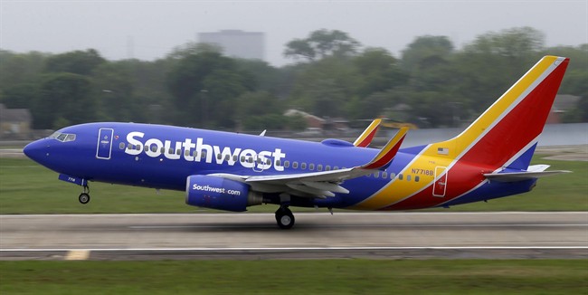 In this April 23, 2015, file photo, a Southwest Airlines jet takes off from a runway at Love Field in Dallas.