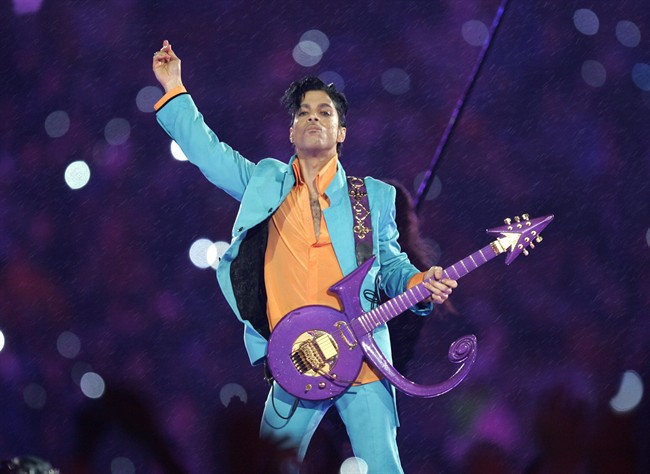  In this Feb. 4, 2007 file photo, Prince performs during the halftime show at the Super Bowl XLI football game at Dolphin Stadium in Miami. 