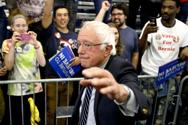 Democratic presidential candidate Sen. Bernie Sanders, I-Vt., waves as he leaves a campaign rally at Fitzgerald Fieldhouse on the University of Pittsburgh campus, Monday, April 25, 2016, in Pittsburgh.