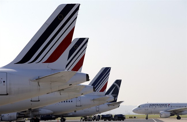 FILE - In this Sept.15, 2014 file photo, Air France planes are parked on the tarmac of the Paris Charles de Gaulle airport, in Roissy, near Paris.