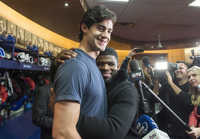 Montreal Canadiens defenceman P.K. Subban, right, hugs captain Max Pacioretty at the team training facility Monday, April 11, 2016 in Brossard, Que.