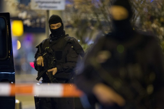 File photo shows hooded security forces guarding a part of Schiphol Aiport in Amsterdam, Netherlands, on Wednesday, April 13, 2016. 