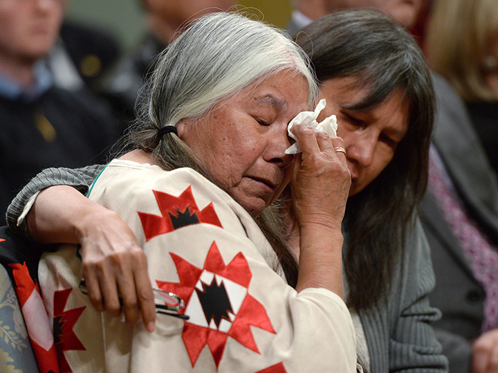 Residential school survivor Lorna Standingready is comforted by a fellow survivor in the audience during the closing ceremony of the Indian Residential Schools Truth and Reconciliation Commission, at Rideau Hall in Ottawa on Wednesday, June 3, 2015. 