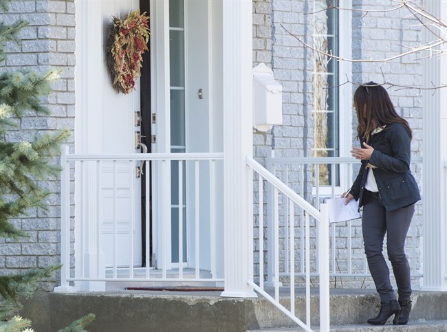 Karla Homolka yells through a crack in the door to Global News reporter Amanda Jelowicki, Wednesday, April 20, 2016 in Chateauguay, Que.
