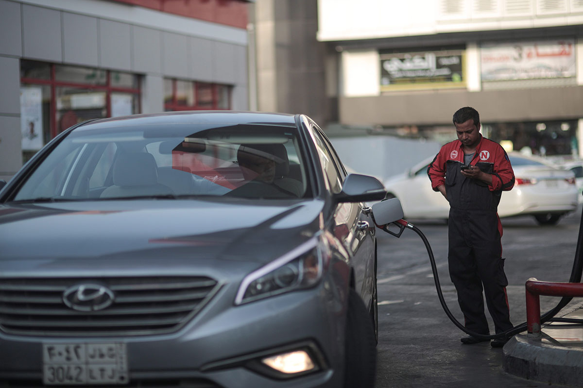  In this Wednesday, Sept. 16, 2015 file photo, a car fills up at a gas station in Jiddah, Saudi Arabia. 