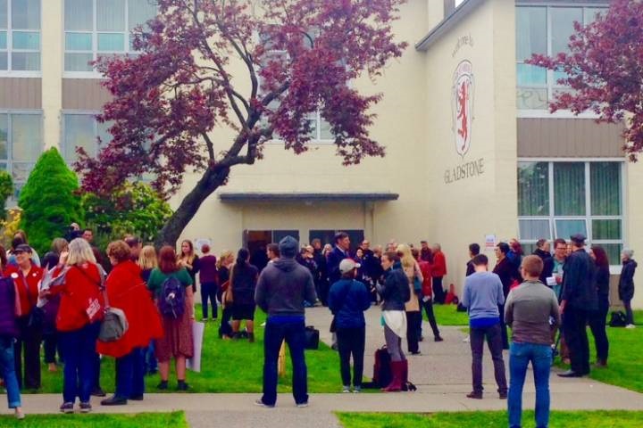 People rally outside of Gladstone Secondary School in Vancouver before a school board meeting on April 28, 2016. 