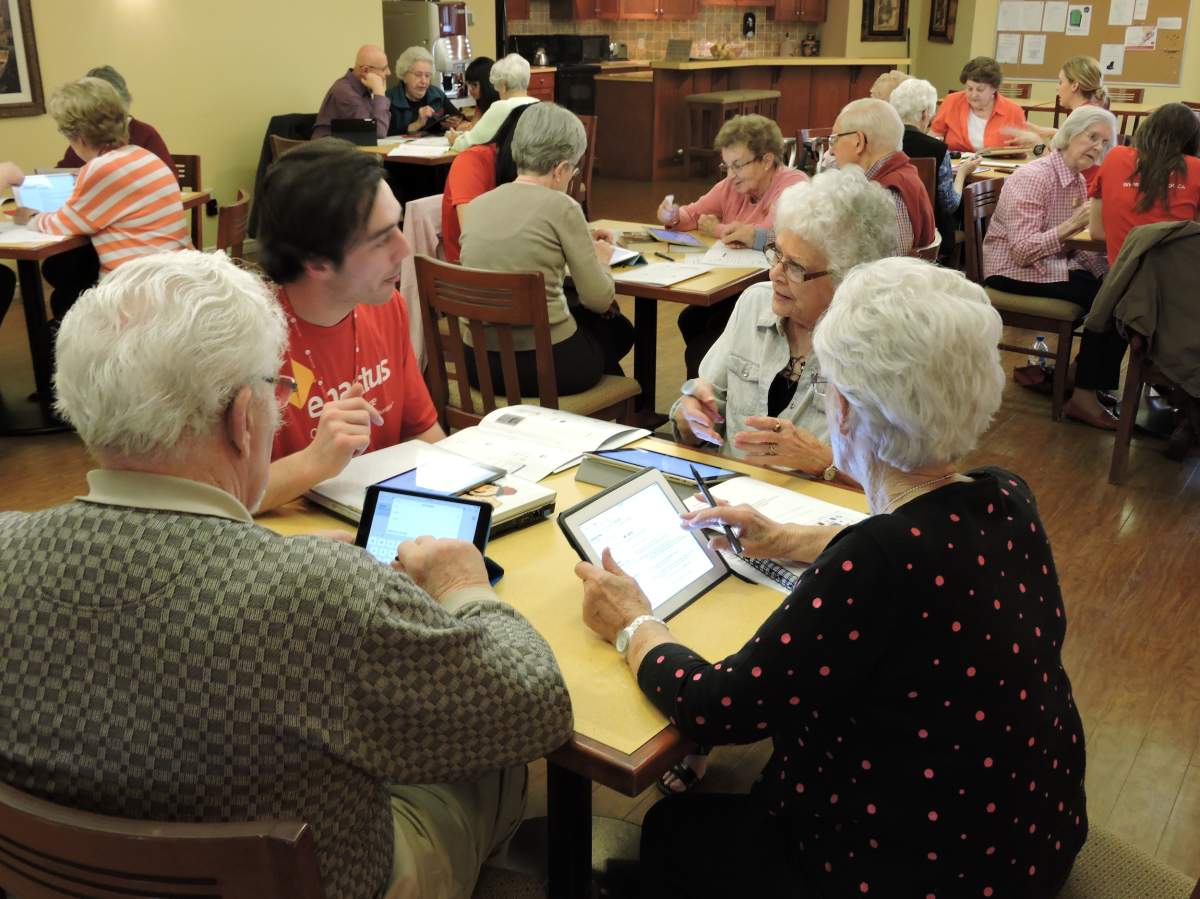 Seniors at Missionwood Retirement Resort learn the art of the iPad first hand from Okanagan College volunteers.
