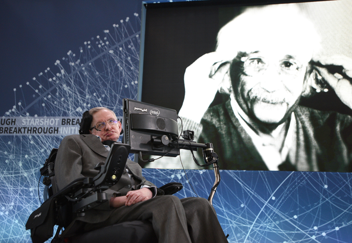 Renowned physicist Stephen Hawking with a photograph of Albert Eintstein at the announcement of Breakthrough Starshot on April 12, 2016.
