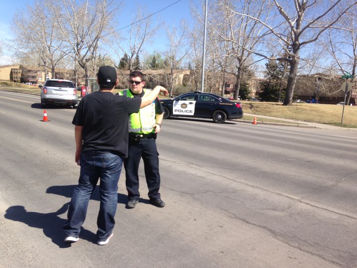 Calgary police on the scene after a suspicious military item was removed from a southwest property April 19, 2016.
