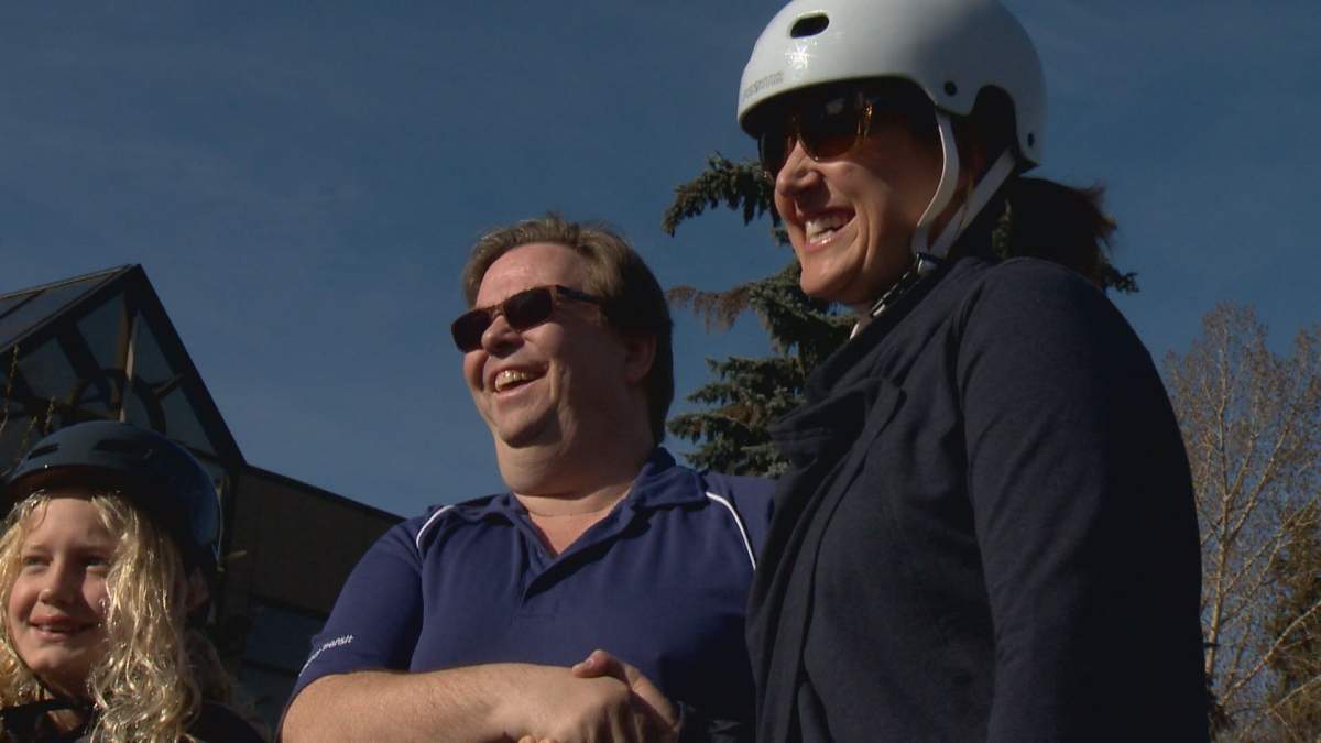 Kerry Urban thanks Calgary Transit driver Mark Boody for preventing her and her daughter from being hit by a car Tuesday.