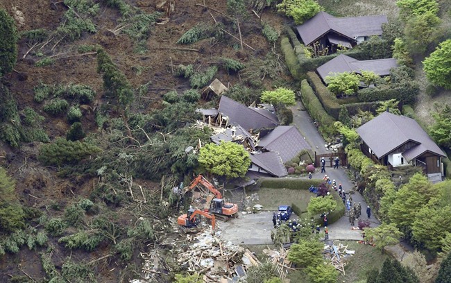 Buildings are collapsed by a landslide caused by an earthquake in Minamiaso village, Kumamoto prefecture, Japan, Saturday, April 16, 2016.