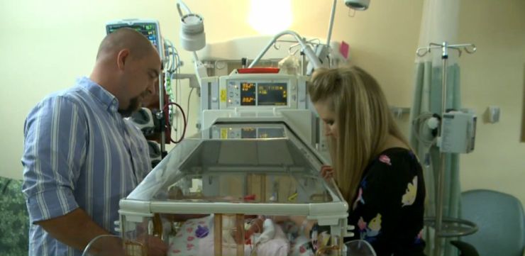Kristen and Ian Miller admire their newborn twins at the NICU of University of Tennessee Medical Center in Knoxville.
