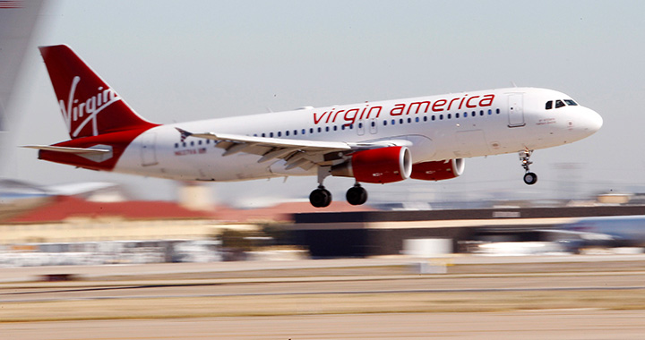 In this Dec. 1, 2010, file photo, Virgin America's inaugural flight between Los Angeles and Dallas Fort Worth International Airport comes in for a landing in Grapevine, Texas. 