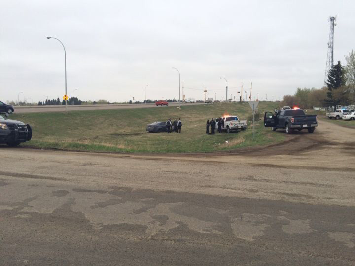  Police officers are seen investigating at 103 Avenue and Winterburn Road in connection with a kidnapping west of Edmonton.



