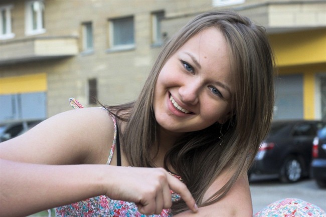 This handout photo taken and released by Elena Sablina, mother of Alina Sablina in 2013 year, shows her daughter somewhere in Moscow, Russia. (Elena Sablina, family handout photo via AP).