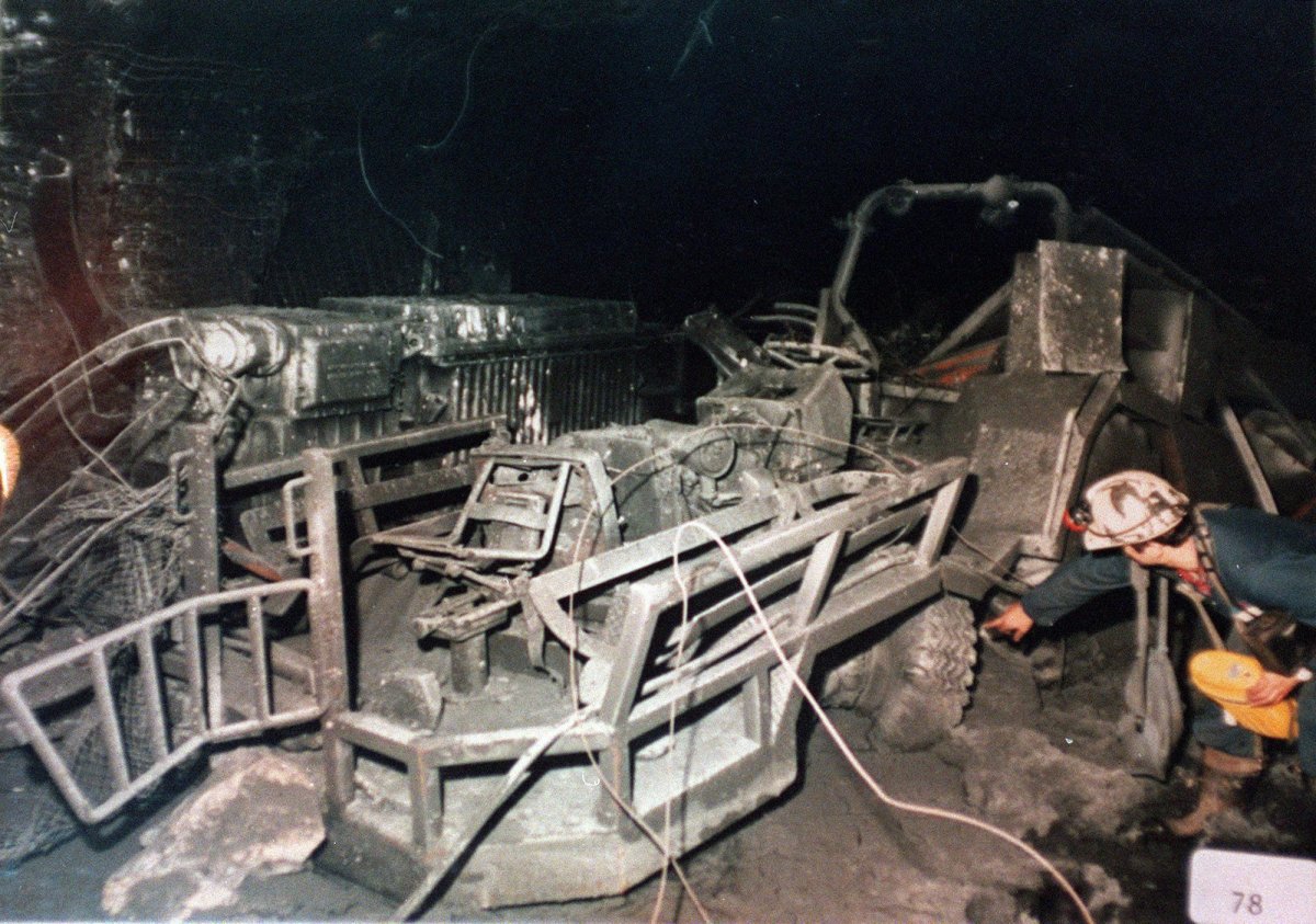 An investigator examines an ambulance tractor inside the Westray mine in this RCMP handout photo.