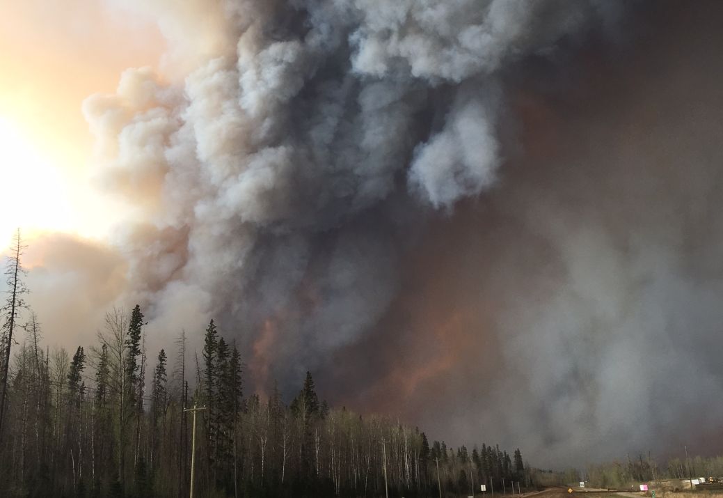 Fort McMurray wildfire stalls before the Saskatchewan border; no threat to communities.