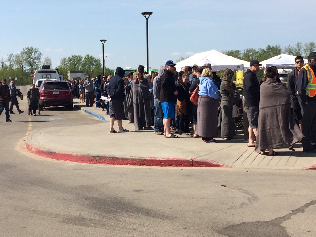 Lines for the pre-loaded debit cards in Lac La Biche on Thursday, May 12, 2016.