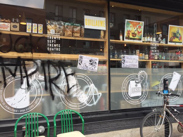 Anti-gentrification messages on the 3734 grocery store in Saint-Henri.