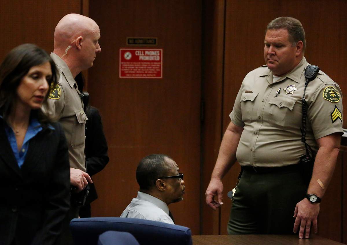Lonnie Franklin Jr., center, sits in count in Los Angeles, Thursday, May 5, 2016. The former trash collector in Los Angeles was convicted Thursday of 10 "Grim Sleeper" serial killings that spanned two decades and targeted vulnerable young black women in the inner city. 
