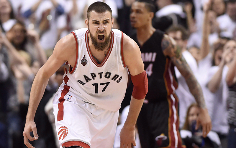 Toronto Raptors' Jonas Valanciunas reacts after scoring from a rebound during second half NBA playoff basketball action against the Miami Heat in Toronto on Thursday, May 5, 2016.