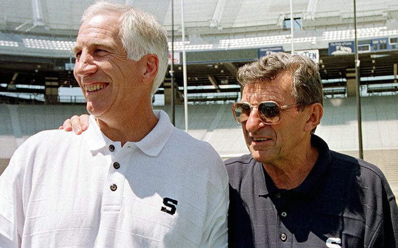 Penn State head football coach Joe Paterno, right, poses with his defensive coordinator Jerry Sandusky during Penn State Media Day at State College, Pa. Penn State President Eric Barron is decrying new allegations in a letter Sunday, May 8, 2016, that former coach Paterno was told that Sandusky had sexually abused a child as early as 1976 and that assistant coaches witnessed the abuse of other children. 