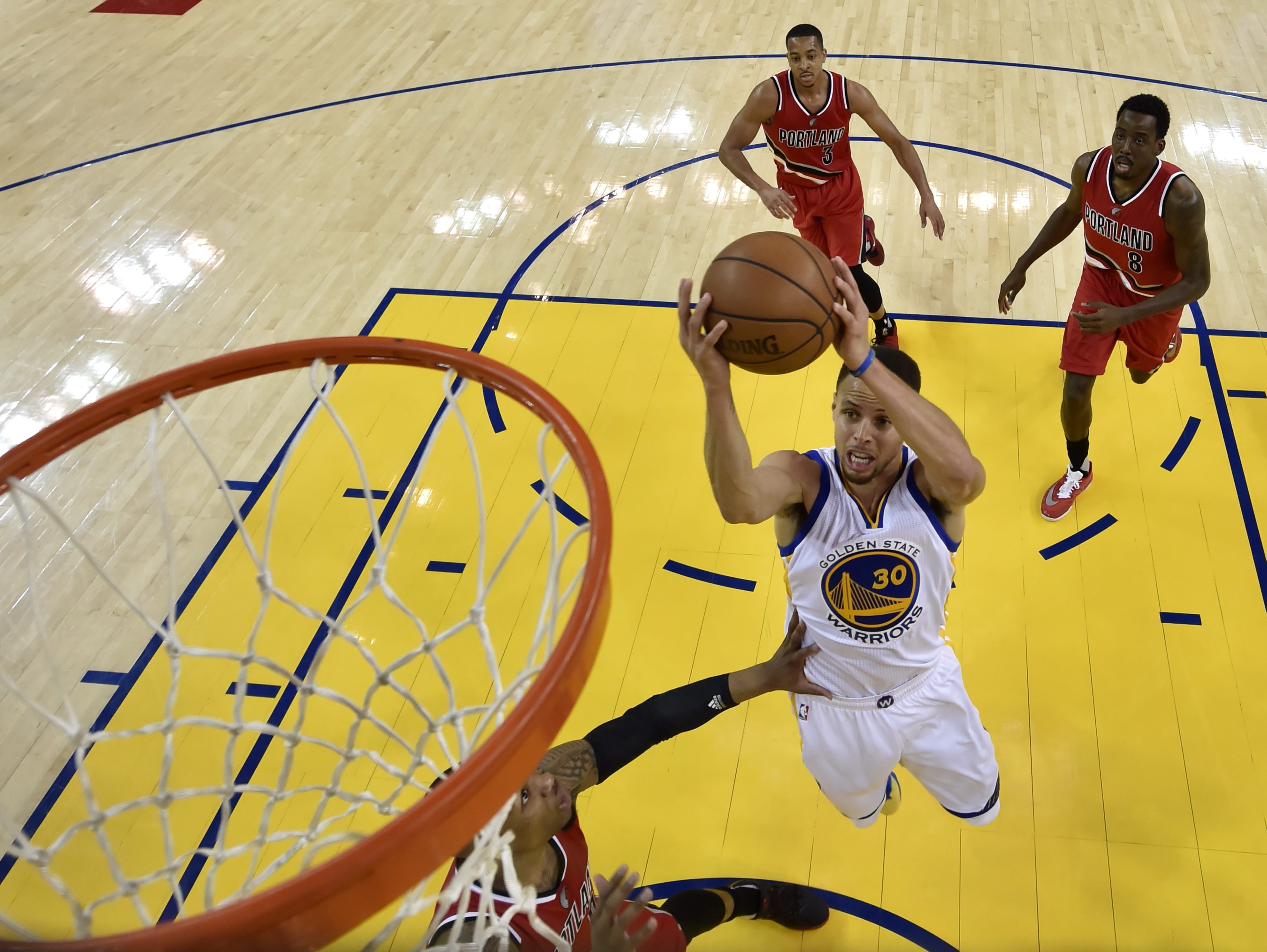 Portland Trail Blazers' CJ McCollum tries to defend against Golden State  Warriors' g/30/ in the first quarter during game 2 of the Western  Conference Finals between the Golden State Warriors and the
