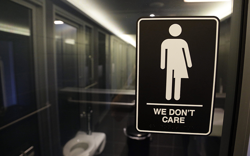 Signage is seen outside a restroom at 21c Museum Hotel in Durham, N.C. North Carolina on May 12, 2016. 