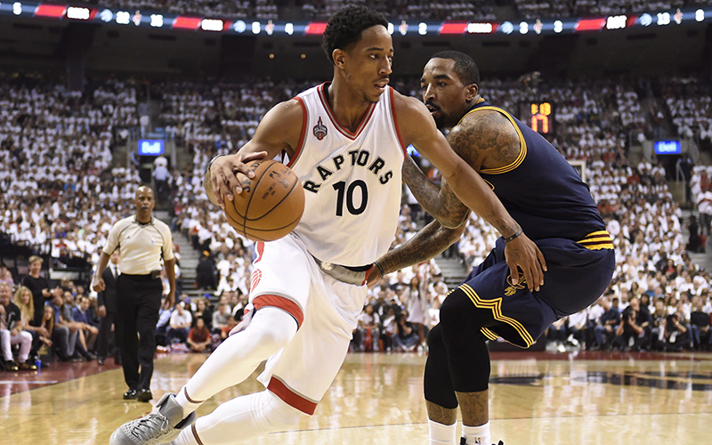 Toronto Raptors guard DeMar DeRozan drives around Cleveland Cavaliers guard-forward J.R. Smith during first half Eastern Conference final NBA playoff basketball action in Toronto on Monday, May 23, 2016. 