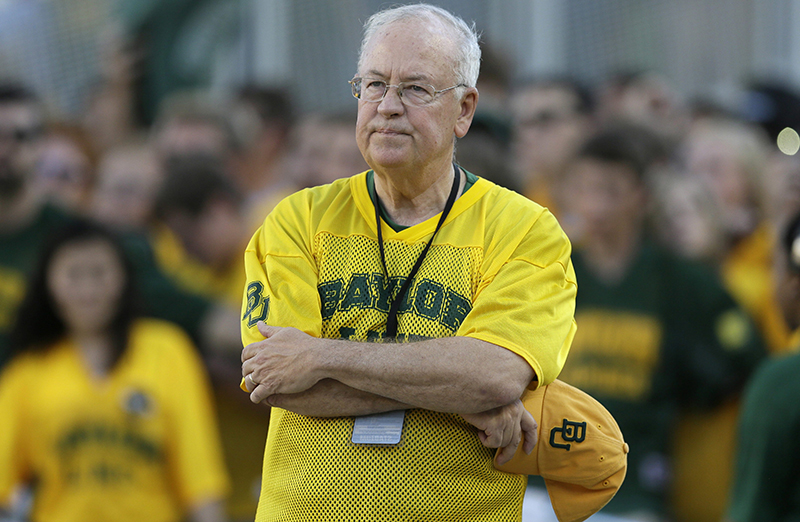 Baylor President Ken Starr waits to run onto the field before an NCAA college football game in Waco, Texas. 