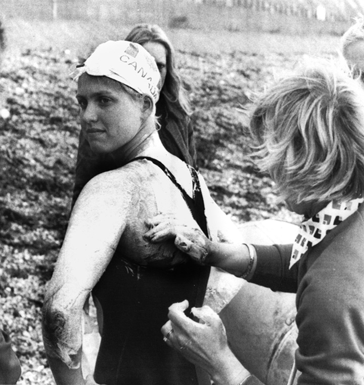 Canadian schoolgirl Cindy Nicholas, 17, from Scarborough, Ontario being greased before plunging into the English Channel July 18, 1975, in a bid to set a new cross channel swimming record. 