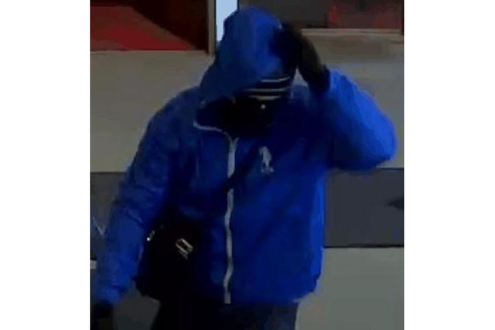 A surveillance photo of a suspect in an armed robbery at the National Bank in Moncton. 