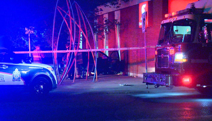 A woman was hospitalized in Saskatoon after a vehicle crashed into a bank late Tuesday night.