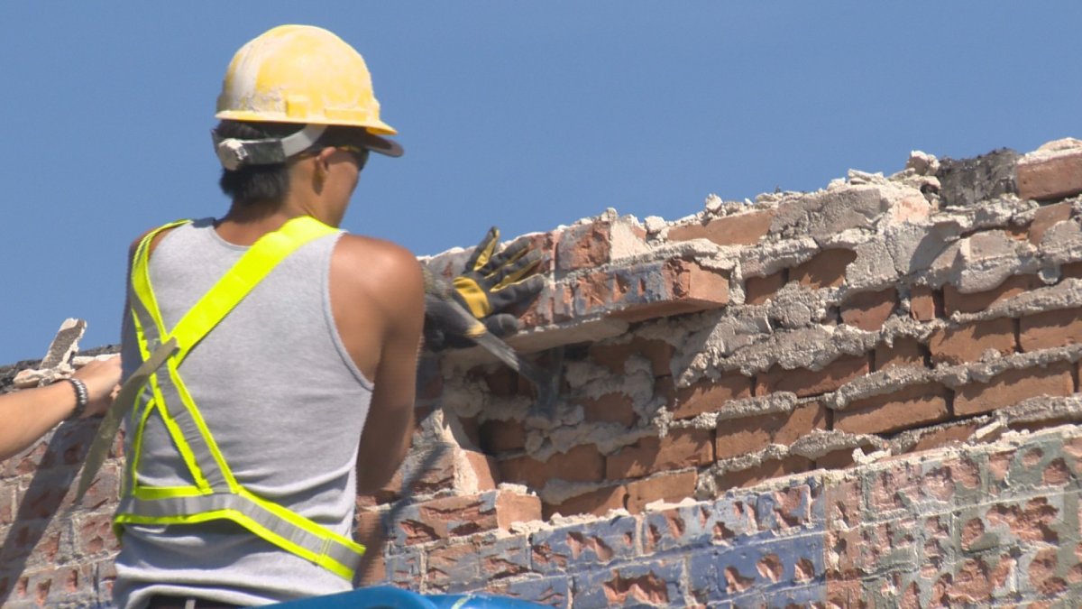 Bricks are being salvaged from an old building Kelowna that is being demolished. 